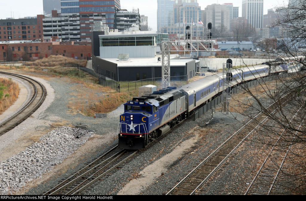 RNCX 1984 leads train P075-15 away from the station